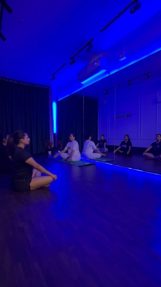 Seated breathing practice in a Netra yoga class